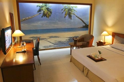 Imagen de la habitación del Hotel Makassar Golden. Foto 8