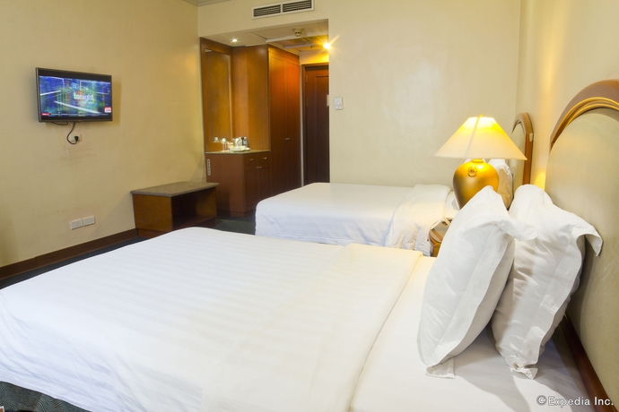 Imagen de la habitación del Hotel Makati Palace. Foto 8