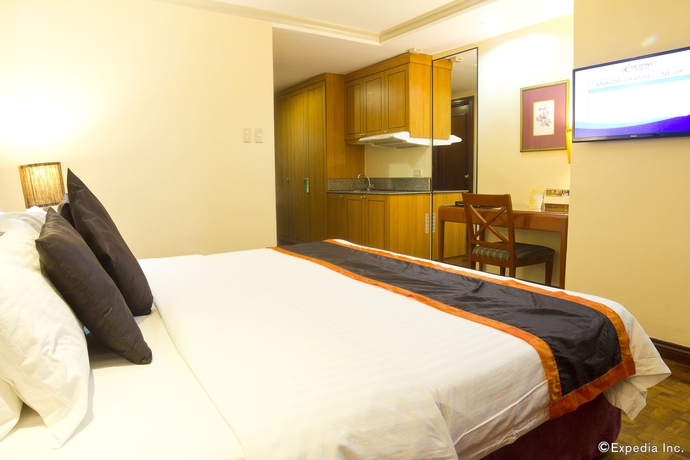 Imagen de la habitación del Hotel Makati Palace. Foto 14