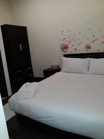 Imagen de la habitación del Hotel Malaya Guesthouse. Foto 7