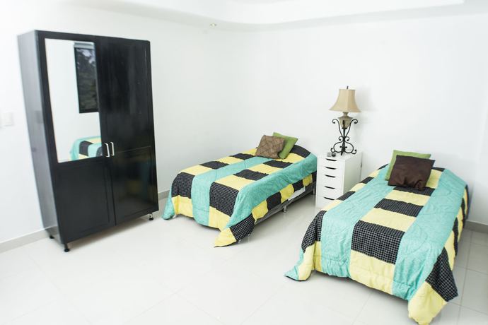 Imagen de la habitación del Hotel Malecon Rooms and. Foto 10