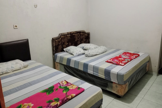 Imagen de la habitación del Hotel Malinda Pangandaran. Foto 4