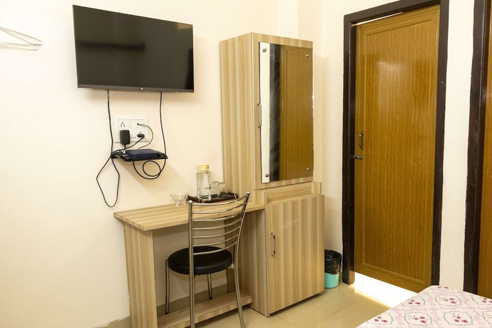 Imagen de la habitación del Hotel Malini Homes - Food and Lodging. Foto 3