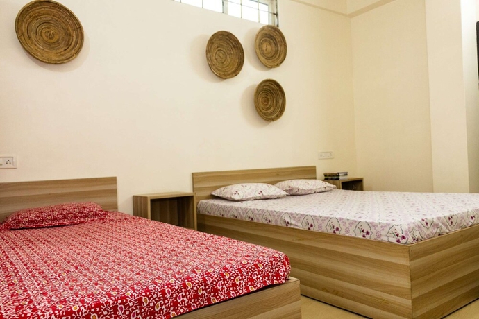 Imagen de la habitación del Hotel Malini Homes - Food and Lodging. Foto 4