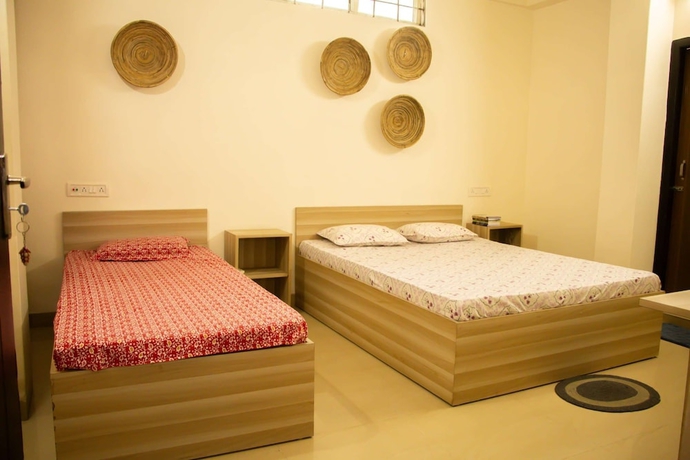 Imagen de la habitación del Hotel Malini Homes - Food and Lodging. Foto 5