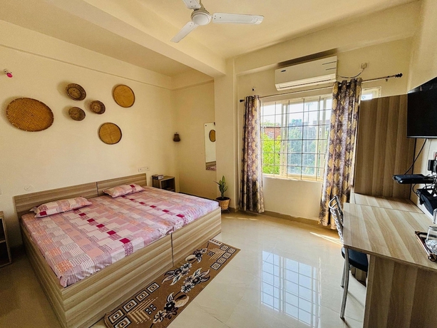 Imagen de la habitación del Hotel Malini Homes - Food and Lodging. Foto 8
