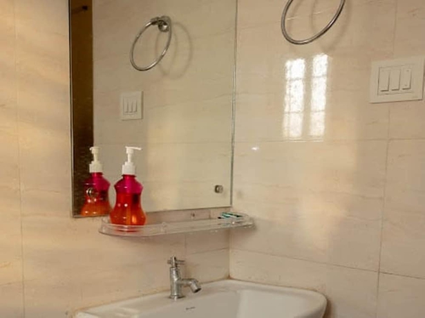 Imagen de la habitación del Hotel Malini Homes - Food and Lodging. Foto 11