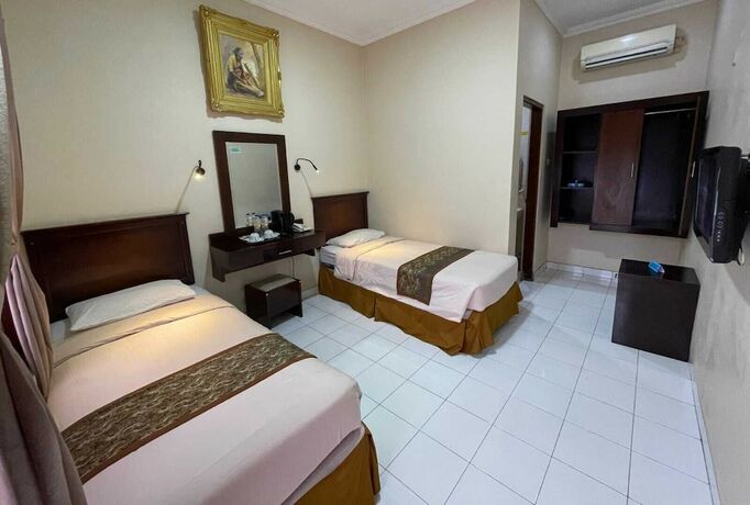 Imagen de la habitación del Hotel Malioboro Inn Yogyakarta. Foto 12