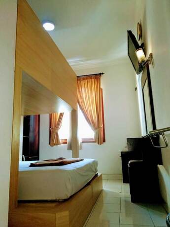 Imagen de la habitación del Hotel Malioboro Inn Yogyakarta. Foto 13