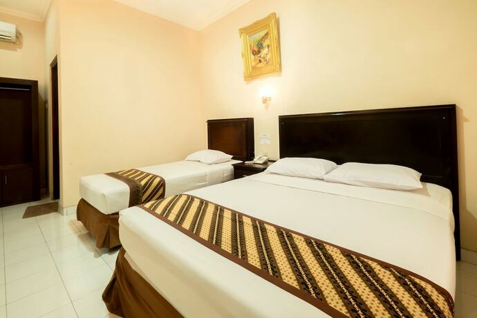 Imagen de la habitación del Hotel Malioboro Inn Yogyakarta. Foto 14