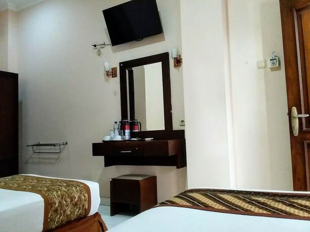 Imagen de la habitación del Hotel Malioboro Inn Yogyakarta. Foto 16