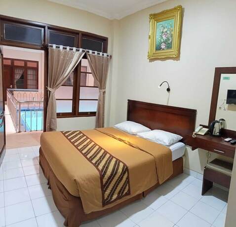 Imagen de la habitación del Hotel Malioboro Inn Yogyakarta. Foto 20