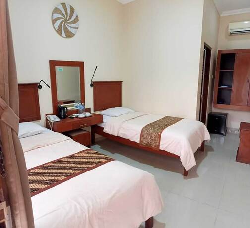 Imagen de la habitación del Hotel Malioboro Inn Yogyakarta. Foto 21