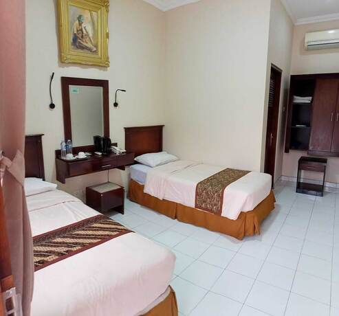 Imagen de la habitación del Hotel Malioboro Inn Yogyakarta. Foto 23