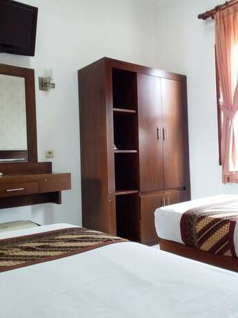 Imagen de la habitación del Hotel Malioboro Inn Yogyakarta. Foto 24