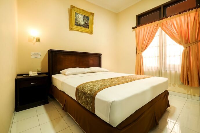 Imagen de la habitación del Hotel Malioboro Inn Yogyakarta. Foto 25