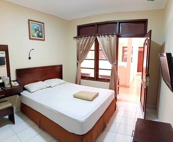 Imagen de la habitación del Hotel Malioboro Inn Yogyakarta. Foto 26
