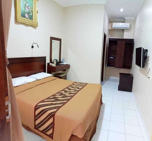 Imagen de la habitación del Hotel Malioboro Inn Yogyakarta. Foto 27