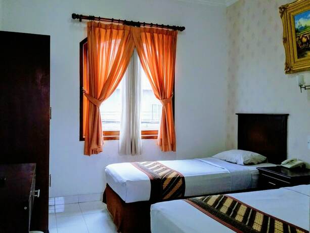 Imagen de la habitación del Hotel Malioboro Inn Yogyakarta. Foto 29