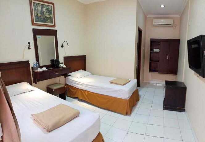 Imagen de la habitación del Hotel Malioboro Inn Yogyakarta. Foto 30
