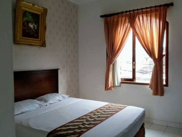 Imagen de la habitación del Hotel Malioboro Inn Yogyakarta. Foto 32