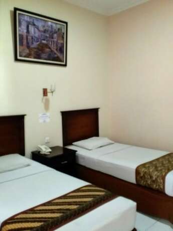 Imagen de la habitación del Hotel Malioboro Inn Yogyakarta. Foto 33