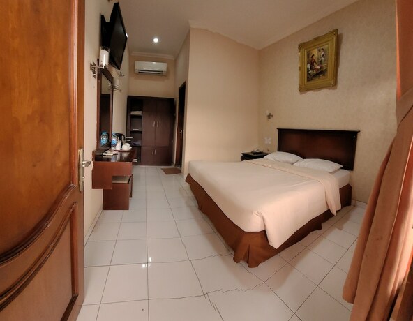 Imagen de la habitación del Hotel Malioboro Inn Yogyakarta. Foto 34