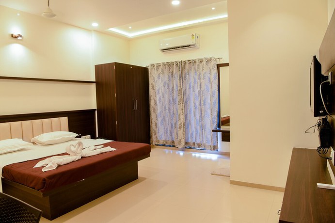 Imagen de la habitación del Hotel Malvan\'s Aishwarya. Foto 11