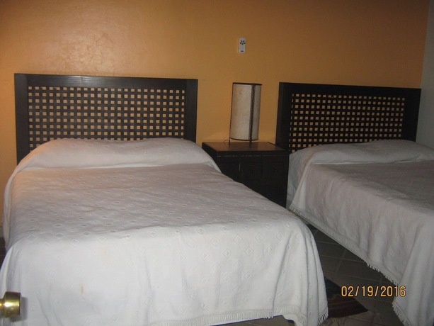 Imagen de la habitación del Hotel Mama Chuy and Villas. Foto 9