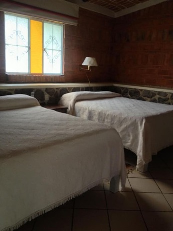 Imagen de la habitación del Hotel Mama Chuy and Villas. Foto 17