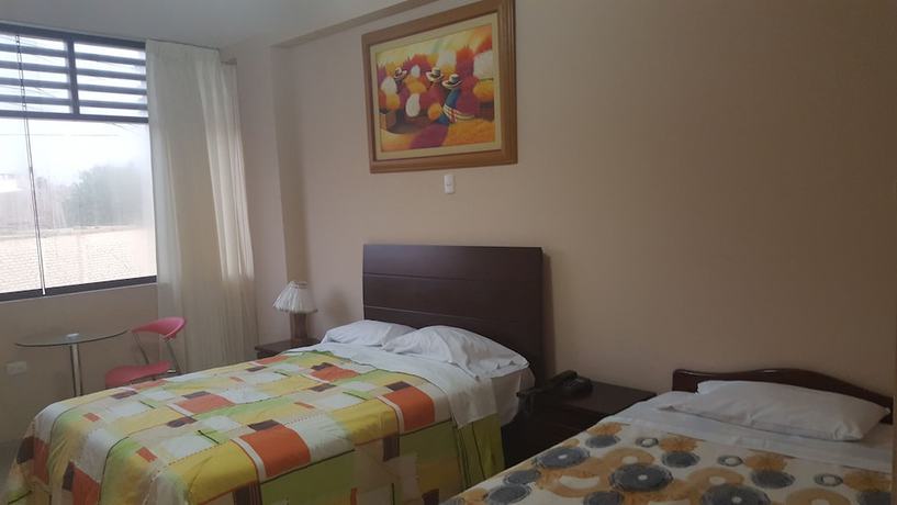 Imagen de la habitación del Hotel Mama Tina. Foto 11