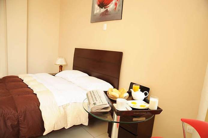 Imagen de la habitación del Hotel Mama Tina. Foto 12