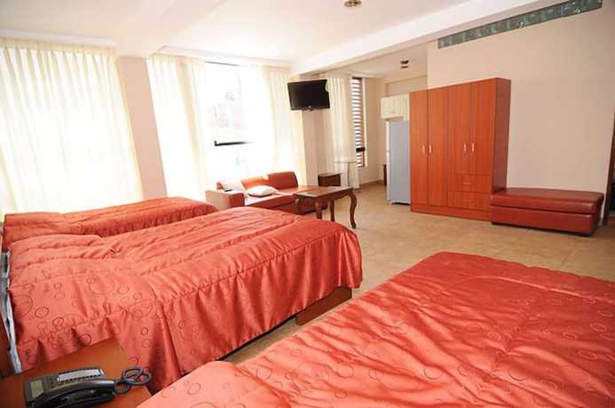 Imagen de la habitación del Hotel Mama Tina. Foto 13