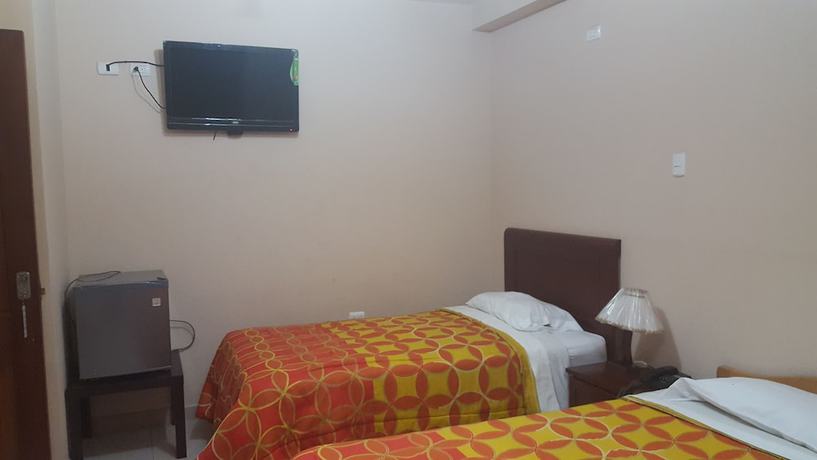 Imagen de la habitación del Hotel Mama Tina. Foto 18