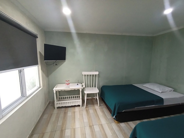 Imagen de la habitación del Hotel Mamifokobo Guest House. Foto 10