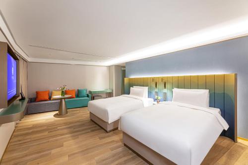 Imagen de la habitación del Hotel Man Xin Zhangjiagang Pedestrian Street. Foto 17