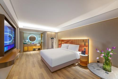 Imagen de la habitación del Hotel Man Xin Zhangjiagang Pedestrian Street. Foto 18