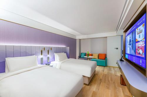 Imagen de la habitación del Hotel Man Xin Zhangjiagang Pedestrian Street. Foto 19