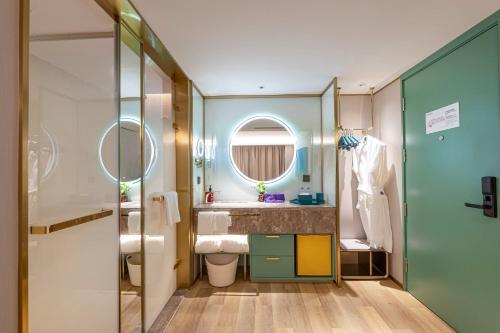 Imagen de la habitación del Hotel Man Xin Zhangjiagang Pedestrian Street. Foto 20