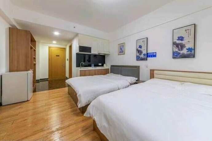 Imagen de la habitación del Hotel ManGo Holiday Internation Apartment. Foto 15