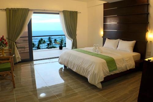 Imagen de la habitación del Hotel Manarra Sea View Resort. Foto 7