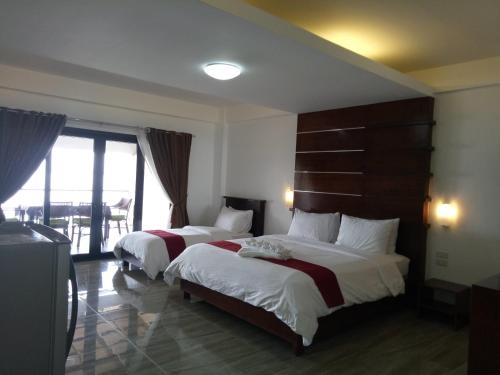 Imagen de la habitación del Hotel Manarra Sea View Resort. Foto 8
