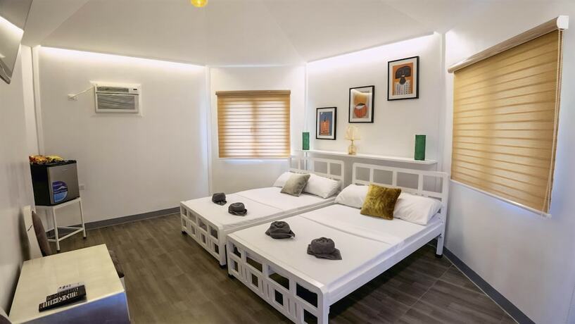 Imagen de la habitación del Hotel Mancion Bakasyunan Resort San Pablo. Foto 17