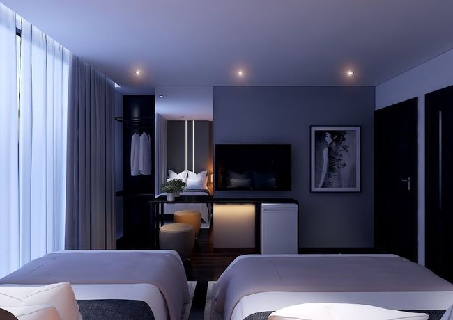 Imagen de la habitación del Hotel MandH. Foto 4