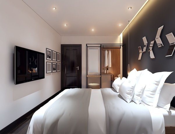 Imagen de la habitación del Hotel MandH. Foto 5