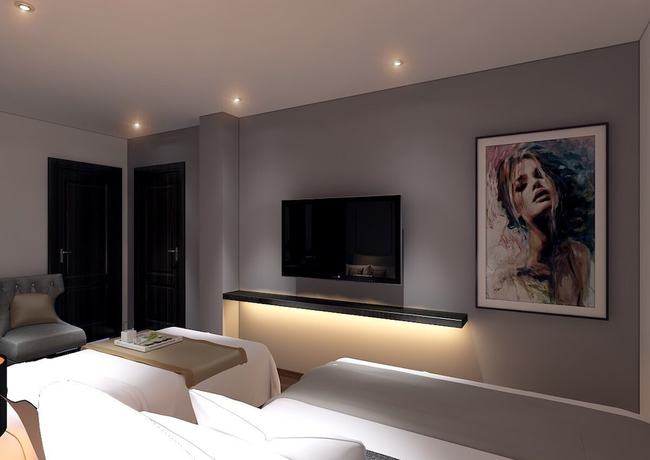 Imagen de la habitación del Hotel MandH. Foto 6