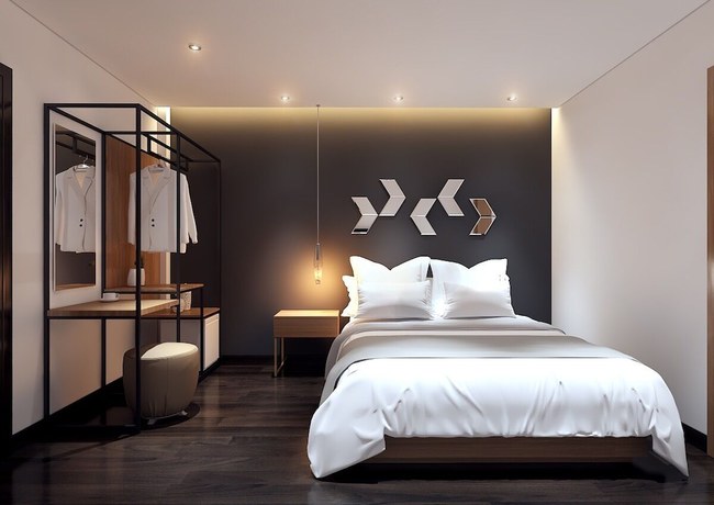 Imagen de la habitación del Hotel MandH. Foto 8