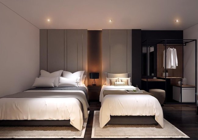 Imagen de la habitación del Hotel MandH. Foto 9