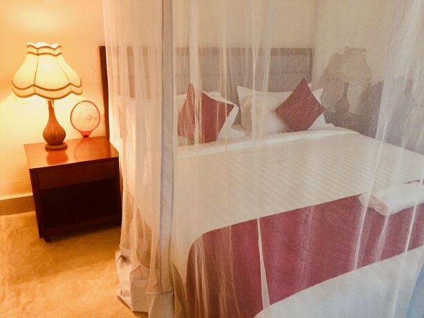 Imagen de la habitación del Hotel Mandhari Villa. Foto 16