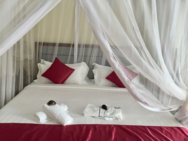 Imagen de la habitación del Hotel Mandhari Villa. Foto 19
